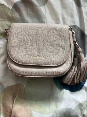 kate spade Pebbled Leather Tassel Crossbody in Beige